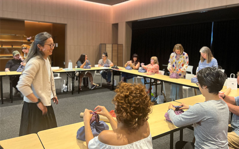 Instructor Kumi Corsa during her “furoshiki” workshop with students at the JAPAN HOUSE LA Salon.