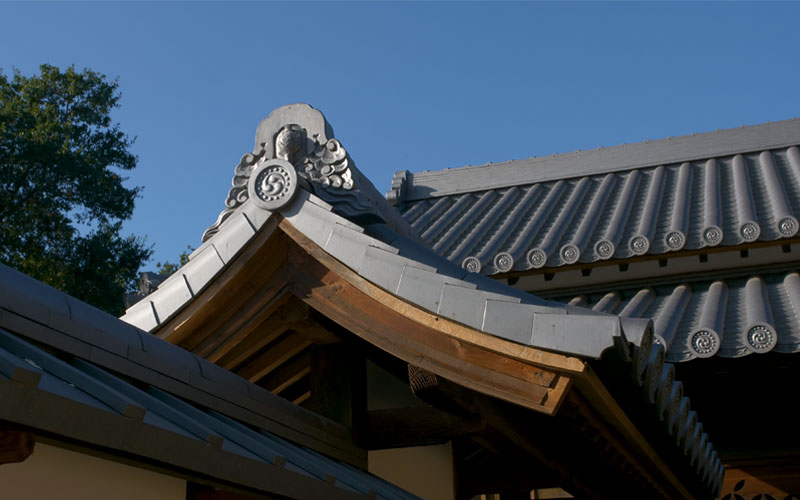 The Yokoi “kamon” (family crest) engraved on the corners of the roof of the reconstructed Shōya House at the Huntington Library.