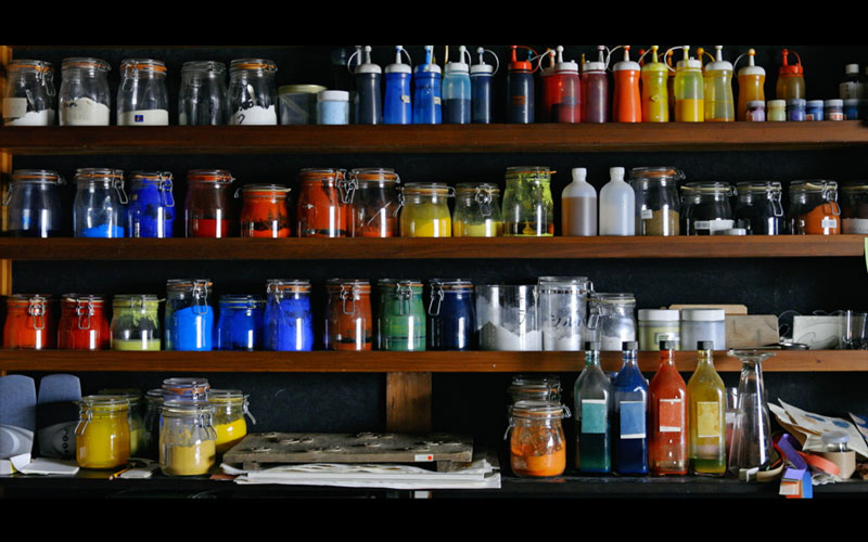 A scene from the documentary film “Ripples of Physis”. A variety of glass bins and containers.