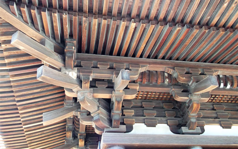 Closeup of woodwork under the roof of a Japanese shrine