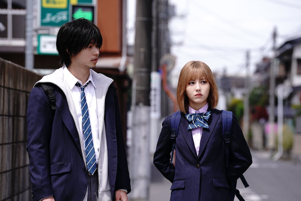 Film still from "Under Ninja." Protagonist, Kuro Kumogakure (Kento Yamazaki) walks next to heroine, Ayaka Noguchi (Minami Hamabe).