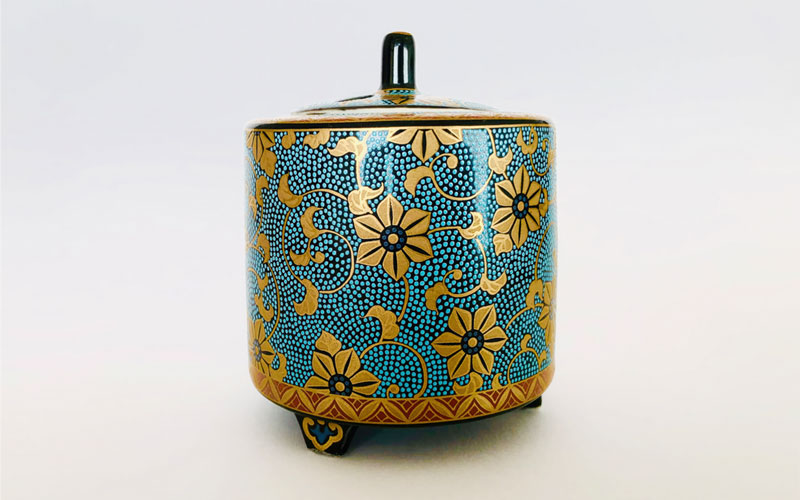 The image displays a piece of Kutani ware, specifically an incense burner, known for its distinctive an vibrant overglaze ename decoration
